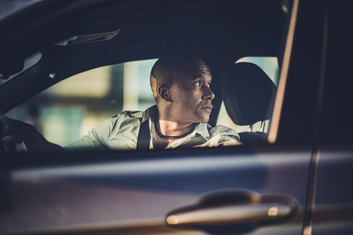 Businessman Reversing Car