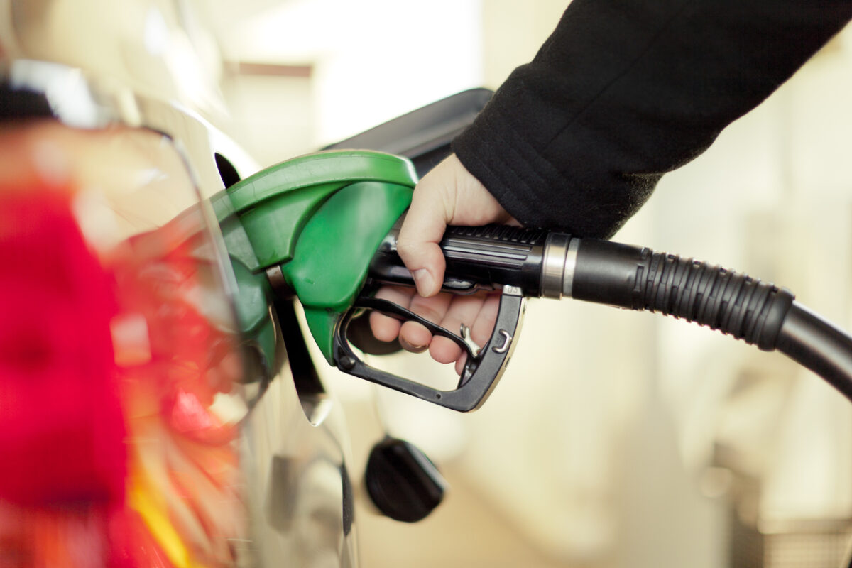 Filling up car with fuel at petrol station