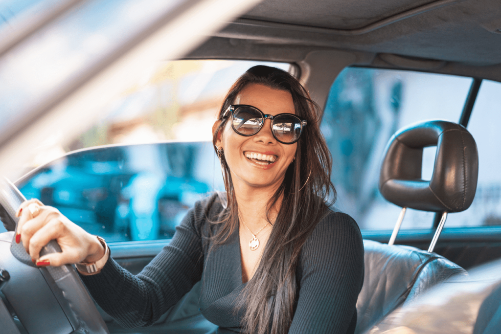Young Woman in New Car
