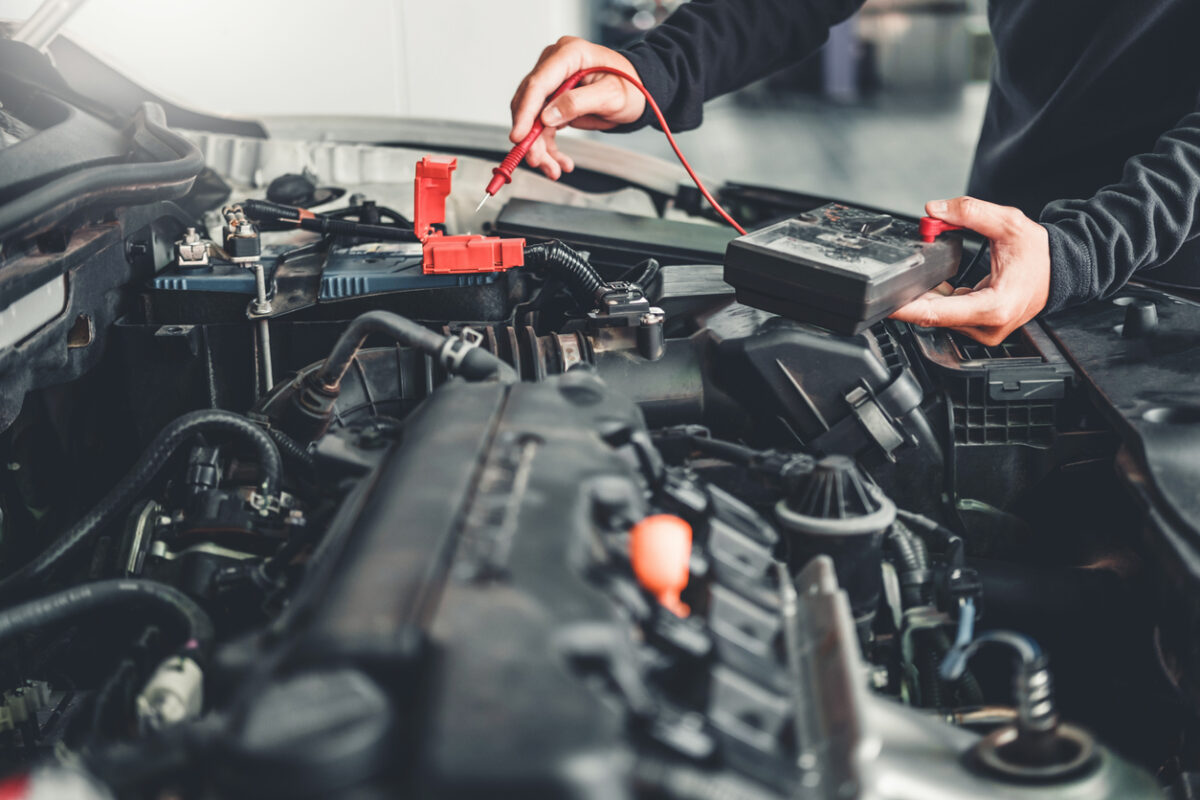 Man Testing Car Battery