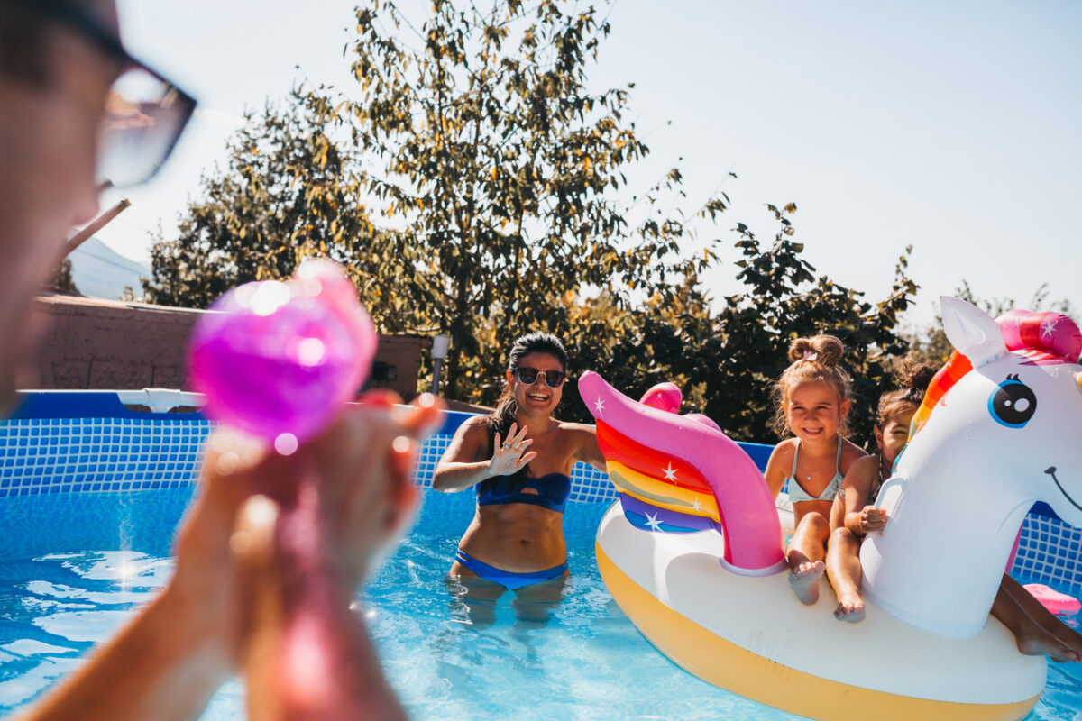 Family Enjoying Swimming Pool