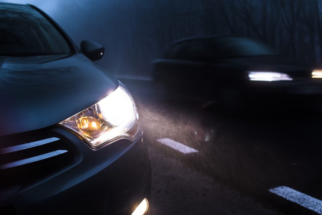 Car Dipped Headlights in Dark